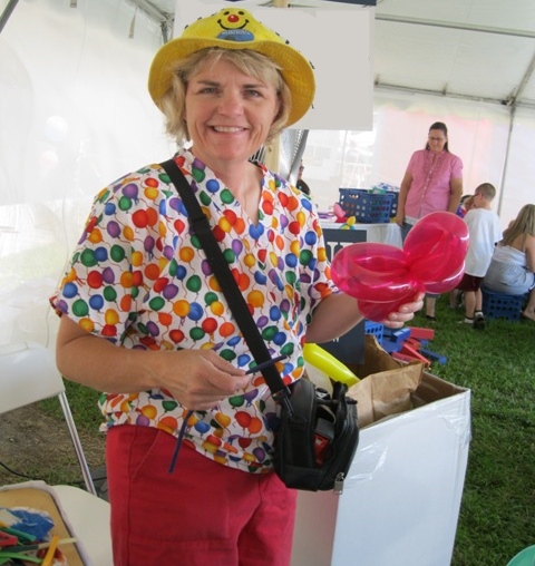 Sally twisting balloons at a corporate event.